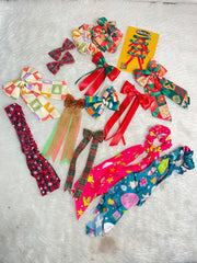 Hair accessories from Personalized Advent Calendar Girls - 12 Day Countdown include festive bows, scrunchies, and ribbons in Christmas colors.