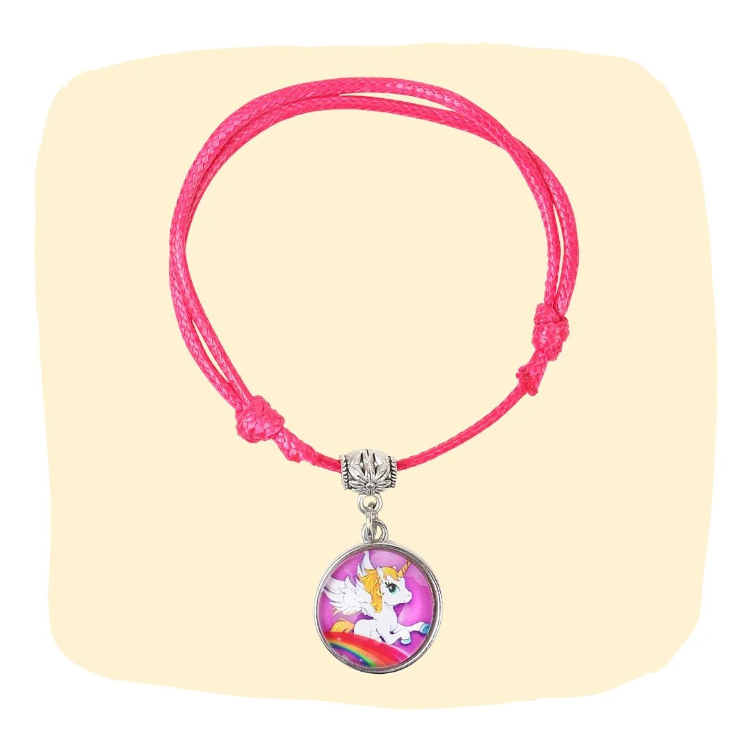 Unicorn Charm Bracelet - Faux Leather Jewelry | Adjustable, Trendy pink bracelet with unicorn charm on beige background. Ideal for girls aged 3 to 7.
