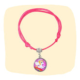 Unicorn Charm Bracelet - Faux Leather Jewelry | Adjustable, Trendy pink bracelet with unicorn charm on beige background. Ideal for girls aged 3 to 7.
