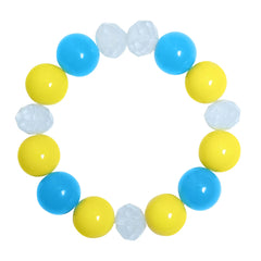 Single bracelet with alternating yellow and blue milky beads and translucent accents. Ideal for stacking and kids' fashion.