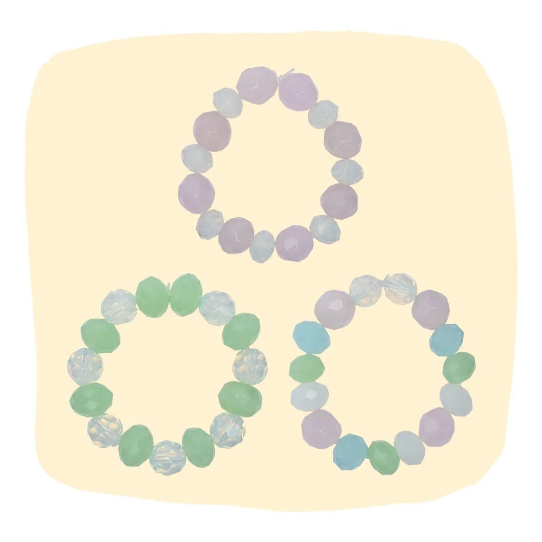 Beaded bracelet set for girls featuring pink, mint, and multi-color designs. Stackable and colorful accessories for ages 3 to 7.