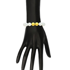 Yellow and white beaded bracelet from the Beaded Bracelets Set - Colorful Jewelry for Kids, shown on a mannequin hand for size reference.