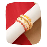 Stackable Clay Bead Bracelet Set featuring four trendy stretch bracelets in peach, orange, and gold tones, ideal for mix & match styling.