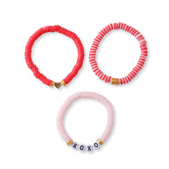 Set of 3 Cotton Candy Bracelets - Stackable Clay Beads in red, striped pink, and pastel pink with XOXO beads, laid flat for display.