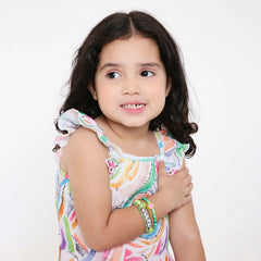 Young girl wearing Matcha Bliss Bracelets - Trendy Clay Bead Teens | Stackable Set styled with colorful outfit, perfect for ages 3 to 7.