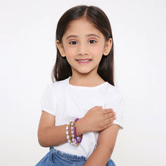 Young girl wearing the Aesthetic Clay Bead Bracelet Stackable Set, showcasing trendy boho jewelry perfect for ages 3 to 7.