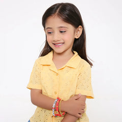 Young girl wearing the Berry Bliss Clay Bead Bracelet Stack, showcasing trendy and playful jewelry perfect for kids and teens.