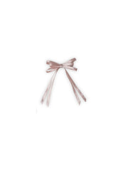 Single light pink satin silk ribbon hair bow on white background. Handmade hair accessory for kids and women in apparel category.