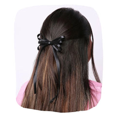 Elegant Handmade Satin Silk Hair Bow in black styled on long brown hair. Adds charm and comfort to women's hairstyles for any occasion.