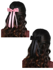 Satin silk ribbon hair bow combo featuring pink and black double bows with long tails, styled on wavy hair. Ideal for elegant girls' hairstyles.