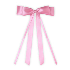 Front view of pink satin silk ribbon bow with long tails. A handmade XXL hair accessory ideal for stylish everyday or special occasion wear.