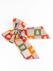 Arendelle Christmas hair bow for girls featuring colorful holiday tree print on soft fabric. Ideal festive accessory for all ages.