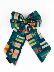 Front view of green Christmas Gift Hair Bow featuring vibrant present patterns, ideal for holiday-themed hair styling.