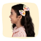 Pastel Yellow Hair Bow - Christmas Hair Bows for Girls styled on young girl with long dark hair, perfect for festive outfits and parties.
