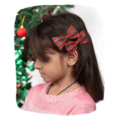 Girl wearing Red Green Hair Bows Combo for Christmas with secure alligator clips, perfect for festive hairstyles and holiday outfits.