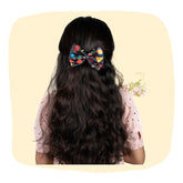 Girl wearing Diwali Fireworks Hair Bow with festive print, perfect for 3 to 12 years. Ideal Diwali hair accessory for girls' celebrations.