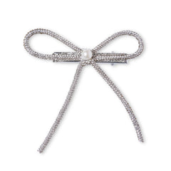 Close-up of Pearl Embellished Rhinestone Hair Bow with long tails. Features secure clip for stylish and durable hair hold.