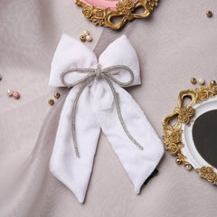 White Velvet Pigtail Hair Bow with Rhinestone Cord displayed on a soft fabric background, ideal for girls and women’s fashion accessories.