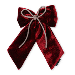 Front view of maroon velvet hair bow with rhinestone cord, highlighting its luxurious finish and symmetrical design.
