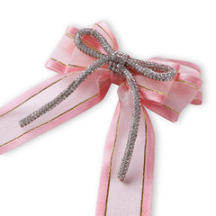 Close-up of pink organza pigtail hair bow featuring a sparkling rhinestone cord, perfect for elegant hair styling and gifting.