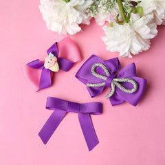 Set of three handmade Pink Purple Hair Bows with glitter loop and ice cream charm, displayed on pink background with white flowers.
