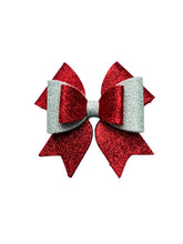 Festive red and silver glitter hair bow for girls, perfect for Christmas outfits. Lightweight and sparkly accessory for holiday celebrations.