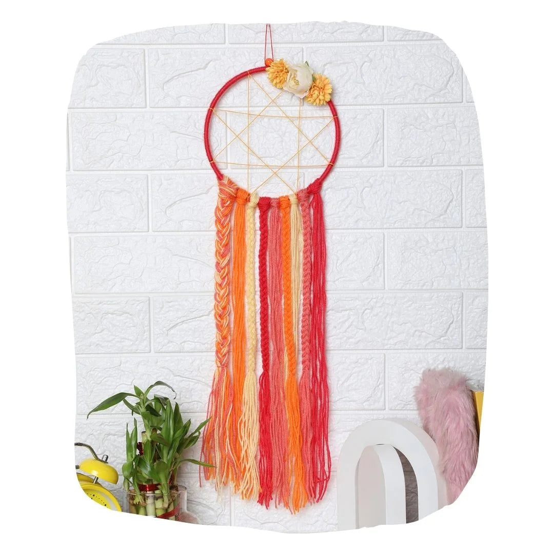 Kids' Room Dreamcatcher Holder in red, orange, and yellow yarn with floral top, ideal for organizing hair accessories and enhancing kids' room decor.