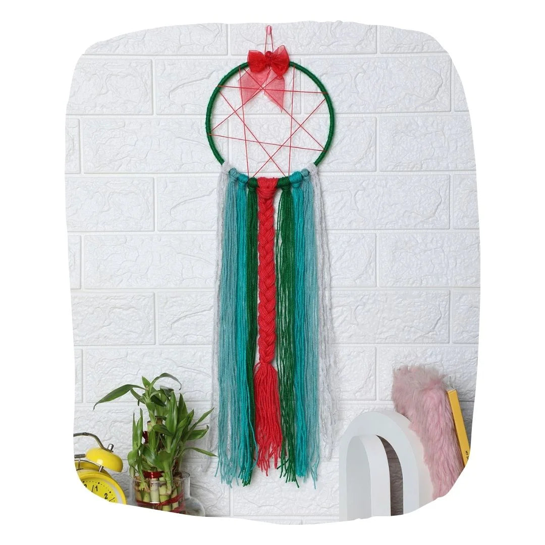Christmas Dreamcatcher Hair Gift with red bow, green hoop, and long yarn strands for organizing bows and hair accessories. Ideal kids' room decor.