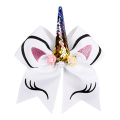 Front view of white Unicorn Cheer Bow with rainbow sequin horn, glitter ears, and floral details. Fun and stylish 7-inch hair accessory.