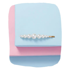 Arendelle's Hair Clips - Stylish Hair Clips for Girls featuring pearl beads on a gold pin, displayed on pastel pink and blue background.