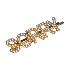 Close-up of SORRY Clip - Gold Glitter Hairpin for Kids. Features gold-tone metal with rhinestone embellishments forming the word 'SORRY'.