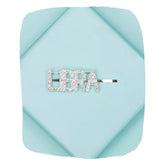 Libra rhinestone zodiac hairpin on a pastel blue background, featuring glittery 'LIBRA' text for stylish astrological hair accessorizing.