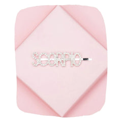 Scorpio Zodiac Hairpin with sparkling rhinestones on a pink geometric background, perfect astrology accessory for stylish hair looks.