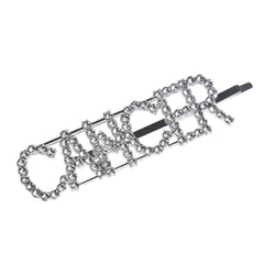 Close-up of silver rhinestone 'CANCER' hairpin. Dazzling zodiac clip for astrology lovers and fashion accessories.