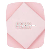 Pisces Rhinestone Hairpin on pink background, featuring sparkling crystals in zodiac lettering for stylish hair accessory with secure grip.