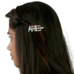ARIES rhinestone hairpin clipped into long dark hair, showcasing a secure and stylish zodiac accessory for girls aged 13+.