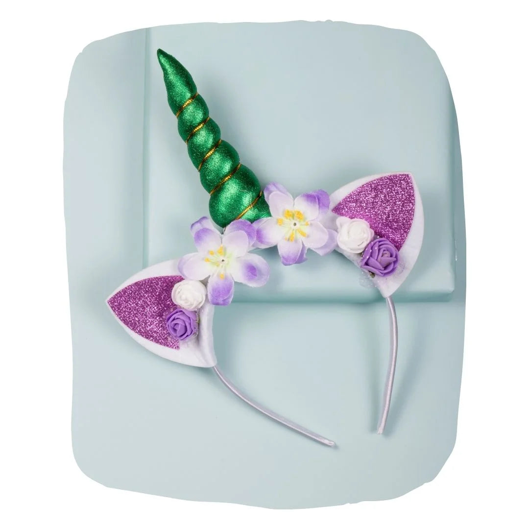 Unicorn horn hairband with green horn, purple glitter ears, and floral accents for girls aged 3-10. Stylish and comfy accessory for parties.