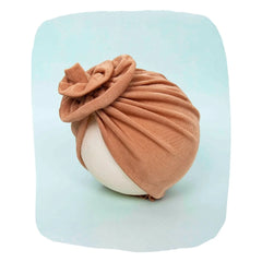 Shiny brown stretchable baby turban cap displayed on a mannequin, made from breathable cotton for baby comfort and daily wear.
