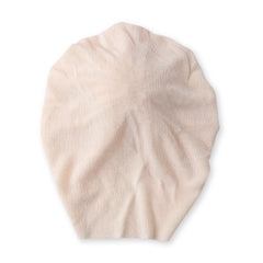 Back view of Beige Baby Turban Cap showing stretchable and seamless design. Ideal for newborn comfort and fit.