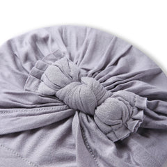 Close-up of the bow knot detail on the Pure Cotton Grey Baby Turban. Features soft pleats and secure stitching for newborn comfort.