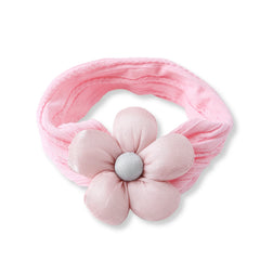 Top view of baby cotton headband in soft pink with a plush flower centerpiece. Breathable and stretchable, perfect for everyday baby wear.