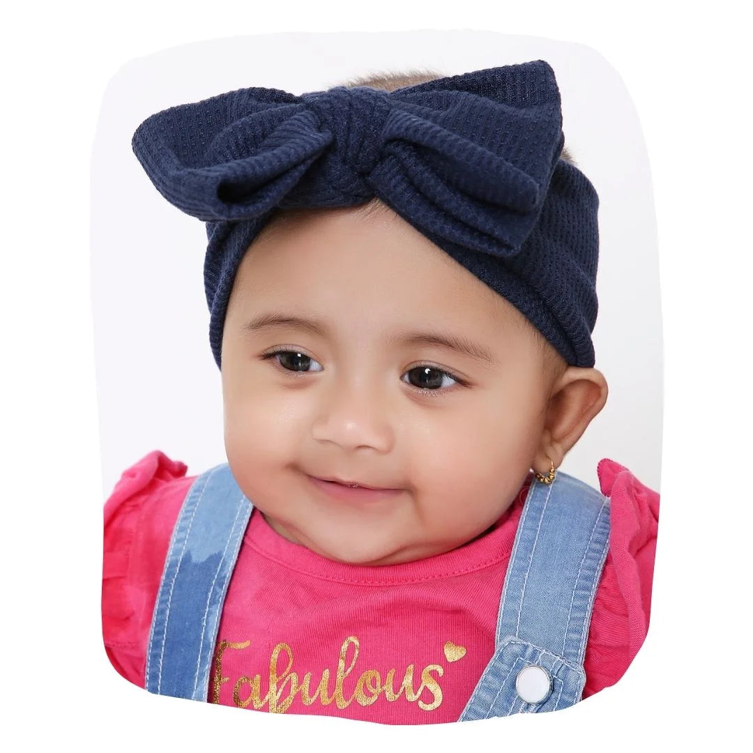 Navy Blue Baby Headband with big bow styled on infant girl, soft cotton fabric ideal for 0 to 2 years. Perfect for daily wear or special occasions.
