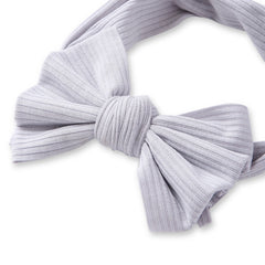 Close-up of Grey Bow Knot Cotton Baby Headband highlighting soft ribbed fabric and detailed bow design. Ideal for stylish baby hair accessory.
