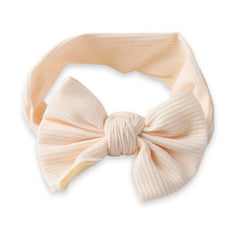 Stylish Baby Cotton Headband with beige bow knot, ribbed texture and soft stretch fit for newborns and toddlers.