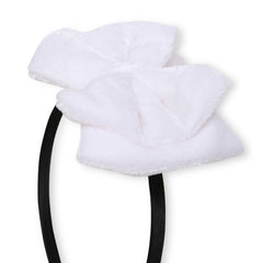 Close-up of soft white velvet double bow on black hairband. Ideal for stylish and gentle hair styling for girls.