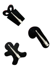 Back view of Arendelle Christmas Glitter Hair Pins showing secure metal clips on festive candy cane, gingerbread man, and gift box shapes.