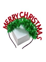 Girls' Glitter Hair Band - Christmas Style displayed on a white box, featuring sparkly red letters and green tinsel for holiday celebrations.