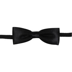 Close-up of black satin bow tie for boys, pre-tied with adjustable strap. Perfect for formal and casual outfits.