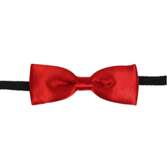 Close-up of red pre-tied satin bow tie for boys with black adjustable strap, perfect for formal outfits and special occasions.