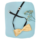 Adjustable Satin Bow Tie - Boys Gold Satin Bow Tie with black strap and clip-on, styled on blue background with floral accent.